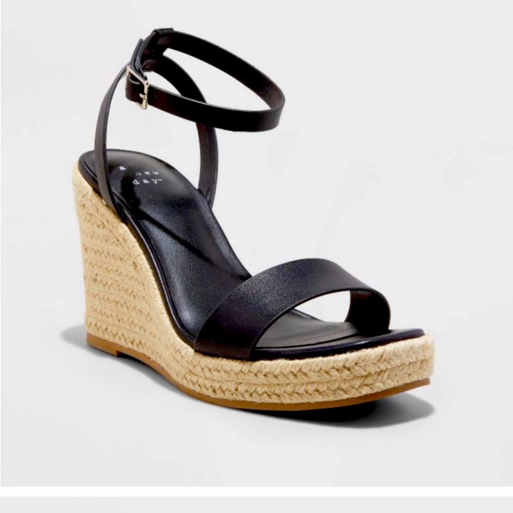 Black leather, women’s size 7.5 tall wedge espadrilles. Brand new, never worn!